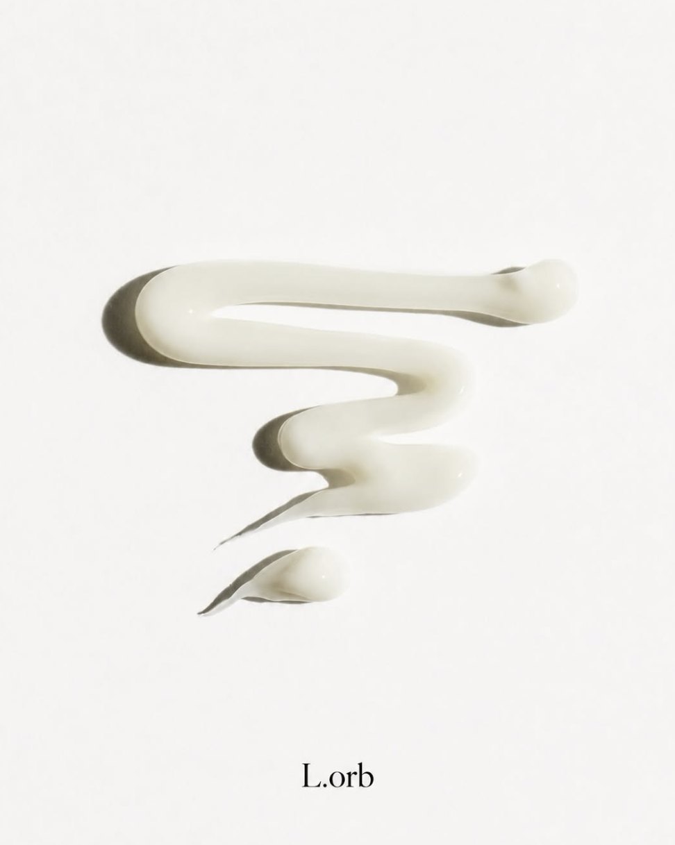 L.orb Hair Studio signature cream, a soft swirl on white